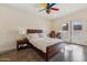 Bright bedroom with wood floors and a built-in desk at 5028 N Scottsdale Rd, Paradise Valley, AZ 85253