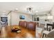 Open dining room with wooden table and view into the kitchen at 5028 N Scottsdale Rd, Paradise Valley, AZ 85253