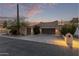 Inviting stucco home with a two-car garage and landscaped yard at 5028 N Scottsdale Rd, Paradise Valley, AZ 85253