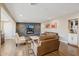 Cozy living room featuring a stone fireplace and comfortable seating at 5028 N Scottsdale Rd, Paradise Valley, AZ 85253