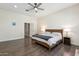 Spacious main bedroom with king bed and hardwood floors at 5028 N Scottsdale Rd, Paradise Valley, AZ 85253