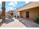 Bright patio with a table and chairs next to the home entrance at 5028 N Scottsdale Rd, Paradise Valley, AZ 85253