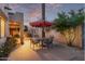 Relaxing patio space with a round table, chairs, and an umbrella at 5028 N Scottsdale Rd, Paradise Valley, AZ 85253