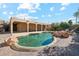 Inviting kidney-shaped pool surrounded by lush landscaping at 5028 N Scottsdale Rd, Paradise Valley, AZ 85253