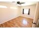 Spacious bedroom with wood flooring and ceiling fan at 513 W Melrose Dr, Casa Grande, AZ 85122