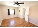 Bedroom with wood flooring, ceiling fan and window at 513 W Melrose Dr, Casa Grande, AZ 85122