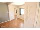 Clean hallway with hardwood floors and coat rack at 513 W Melrose Dr, Casa Grande, AZ 85122