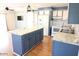 Modern kitchen with granite countertops and blue cabinets at 513 W Melrose Dr, Casa Grande, AZ 85122