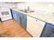 Kitchen with granite countertop and blue cabinets at 513 W Melrose Dr, Casa Grande, AZ 85122