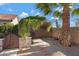 Backyard patio with arbor, gate, and gravel at 5415 W Pontiac Dr, Glendale, AZ 85308