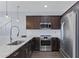 Modern kitchen with stainless steel appliances and granite countertops at 5415 W Pontiac Dr, Glendale, AZ 85308