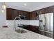 Modern kitchen with stainless steel appliances and granite countertops at 5415 W Pontiac Dr, Glendale, AZ 85308