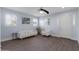 Living room with hardwood floors, a ceiling fan, and neutral decor at 5415 W Pontiac Dr, Glendale, AZ 85308