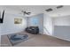 Spacious loft area with carpet and ceiling fan at 5415 W Pontiac Dr, Glendale, AZ 85308