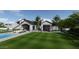 Spacious backyard with pool, lawn, and outdoor seating area at 5446 E Exeter Blvd, Phoenix, AZ 85018