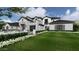 Two-story house with stone exterior, landscaping, and large windows at 5446 E Exeter Blvd, Phoenix, AZ 85018