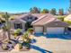 Single-story home with landscaped yard and two-car garage at 5500 N Globe Dr, Eloy, AZ 85131