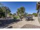 Landscaped backyard with patio, seating, and plants at 5500 N Globe Dr, Eloy, AZ 85131