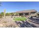 Landscaped backyard with putting green and desert plants at 5500 N Globe Dr, Eloy, AZ 85131