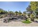 Serene backyard with a pond, bridge, and fountain, creating a relaxing atmosphere at 5500 N Globe Dr, Eloy, AZ 85131