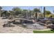 Landscaped backyard featuring a pond with bridge and fountain at 5500 N Globe Dr, Eloy, AZ 85131