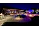 Backyard with fire pit, seating, and lighting at 5500 N Globe Dr, Eloy, AZ 85131