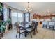 Sunlit dining area features a dark wood table and kitchen views at 5500 N Globe Dr, Eloy, AZ 85131