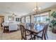 Formal dining room with dark wood table and access to backyard patio at 5500 N Globe Dr, Eloy, AZ 85131