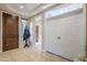 Bright and spacious entryway with tile flooring and coat rack at 5500 N Globe Dr, Eloy, AZ 85131