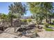 Landscaped backyard with pond, bridge, and fire pit at 5500 N Globe Dr, Eloy, AZ 85131