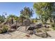 Landscaped backyard with pond, bridge, and fire pit at 5500 N Globe Dr, Eloy, AZ 85131