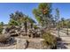 Relaxing water feature with a bridge and lush landscaping at 5500 N Globe Dr, Eloy, AZ 85131