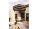 Modern entryway with a covered porch and desert landscaping at 6702 E Cholla St, Scottsdale, AZ 85254