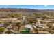 Aerial view of a modern home nestled in a residential neighborhood near mountains at 744 E Desert Ln, Phoenix, AZ 85042