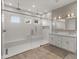 Modern bathroom with double vanity and large walk-in shower at 744 E Desert Ln, Phoenix, AZ 85042