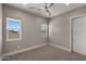 Bright bedroom featuring carpet flooring and ceiling fan at 744 E Desert Ln, Phoenix, AZ 85042