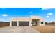 Modern home exterior with two-car garage and clean lines at 744 E Desert Ln, Phoenix, AZ 85042