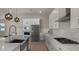 Modern kitchen with white cabinets, farmhouse sink, and gas range at 744 E Desert Ln, Phoenix, AZ 85042