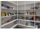 Well-stocked pantry with ample shelving for storage at 744 E Desert Ln, Phoenix, AZ 85042