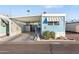 Light blue mobile home with carport at 7807 E Main St # B-15, Mesa, AZ 85207