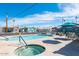 Inviting community pool and spa with ample seating and shade structures at 7807 E Main St # B-15, Mesa, AZ 85207