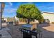 Backyard with mature citrus tree and built-in gas grill at 8500 E Southern Ave # 126, Mesa, AZ 85209