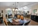 Bright dining room with an oval table and view into the living room at 8500 E Southern Ave # 506, Mesa, AZ 85209