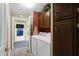 Convenient laundry room with washer, dryer, and storage cabinets at 8500 E Southern Ave # 506, Mesa, AZ 85209