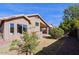 Grass backyard with gravel pathway and landscape at 8605 W Paradise Dr, Peoria, AZ 85345