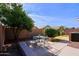 Landscaped backyard with a patio and seating area at 8605 W Paradise Dr, Peoria, AZ 85345