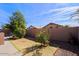 Backyard with grass lawn and mature trees at 8605 W Paradise Dr, Peoria, AZ 85345