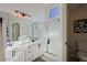 Modern bathroom with double vanity and walk-in shower at 8605 W Paradise Dr, Peoria, AZ 85345