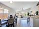 Casual dining area with a round table, four chairs, and natural light at 8605 W Paradise Dr, Peoria, AZ 85345