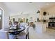 Bright dining area with a round table and four chairs, next to kitchen at 8605 W Paradise Dr, Peoria, AZ 85345